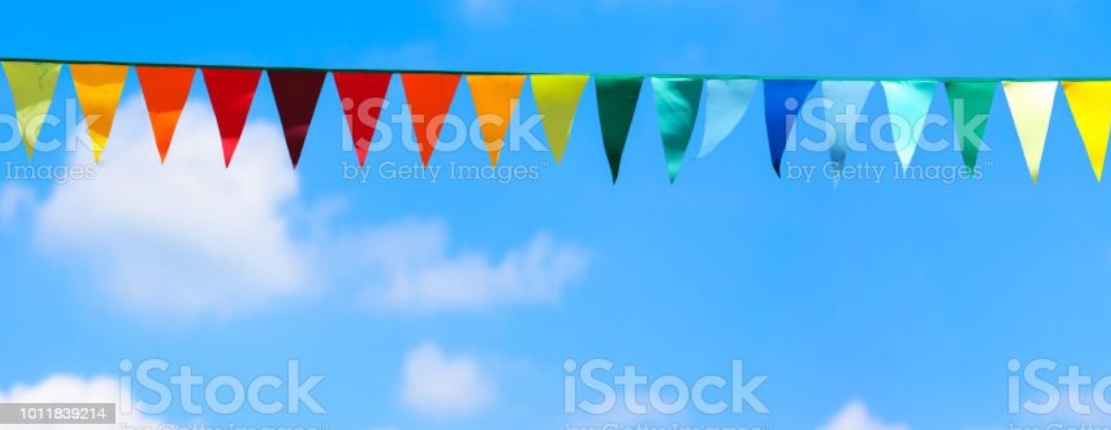 Colorful pendant flags on blue sky